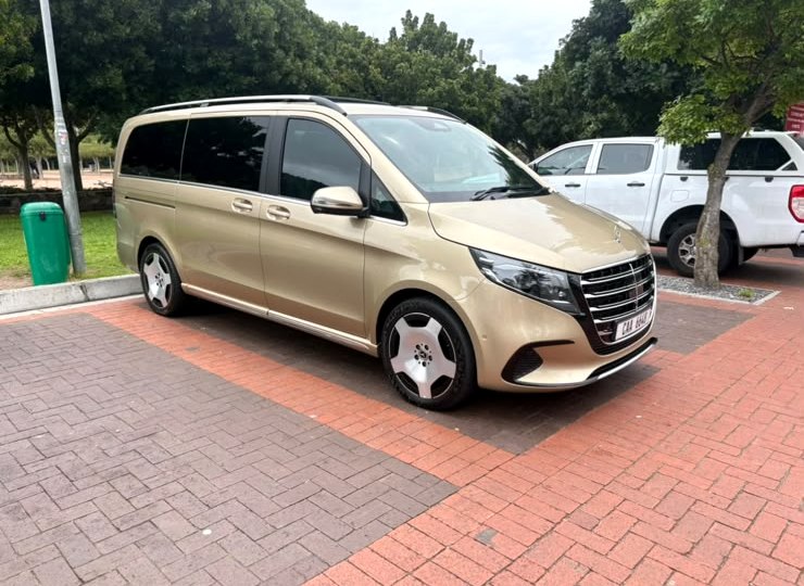 Gold Mercedes V-Class van parked on brick paving